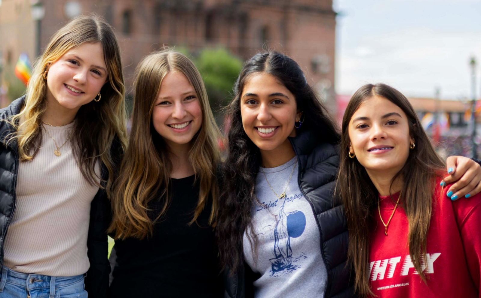 A group of young Projects Abroad participants stand outside in Cusco, Peru.